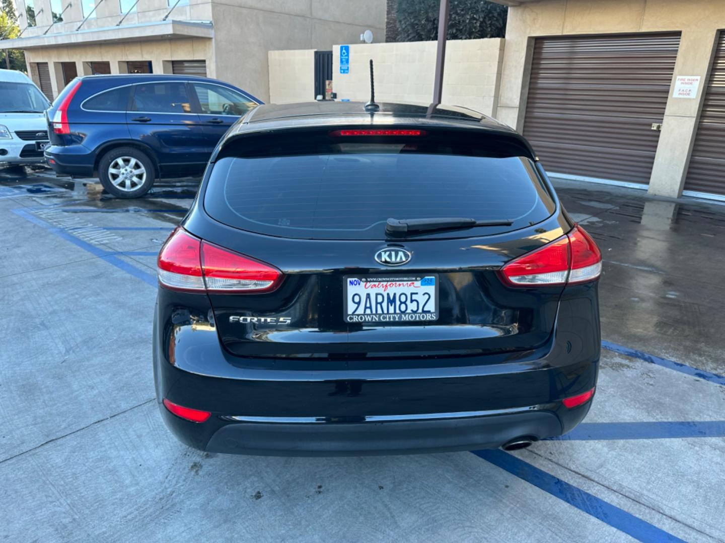 2016 Black /Black Kia Forte 5-Door Cloth (KNAFK5A87G5) with an 4 CYLINDER engine, Automatic transmission, located at 30 S. Berkeley Avenue, Pasadena, CA, 91107, (626) 248-7567, 34.145447, -118.109398 - Embark on a Journey of Style and Efficiency with the 2016 Kia Forte Hatch - Now Available at Our Premier Pasadena, CA Dealership Welcome to our BHPH dealership in Pasadena, CA, where we proudly present the 2016 Kia Forte Hatch, a vehicle that seamlessly blends stylish design, modern technology, a - Photo#3